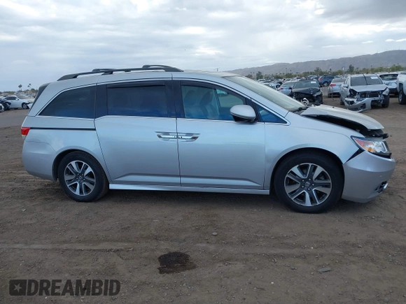 2014 Honda Odyssey Touring with VIN 5FNRL5H93EB066162, listed as a IAAI auction lot 41734783 with 173,063 mi miles and . Bid and sale history available at DreamBid. Image 13.