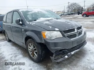 2014 Dodge Grand Caravan SE with VIN 2C4RDGBG8ER470014, listed as a IAAI auction lot 41553310 with 147,657 mi miles and . Bid and sale history available at DreamBid. Image 1.
