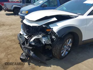 2021 Mazda CX-30 Select with VIN 3MVDMBBL9MM313039, listed as a IAAI auction lot 42575424 with 21,083 mi miles and . Bid and sale history available at DreamBid. Image 6.