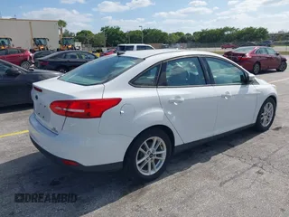 2015 Ford Focus SE with VIN 1FADP3F23FL329375, listed as a IAAI auction lot 42170945 with 114,180 mi miles. Bid and sale history available at carsss.com. Image 4.