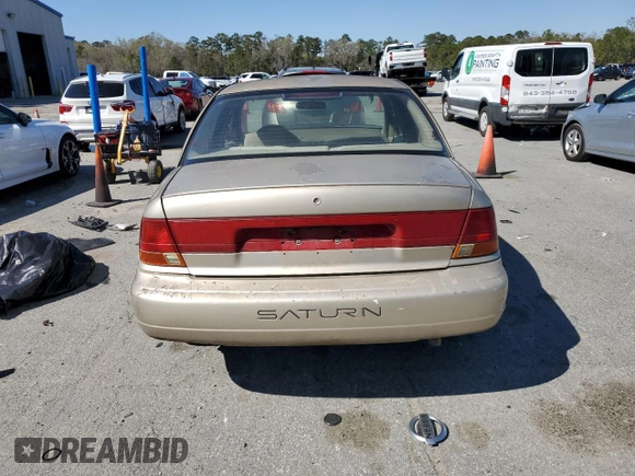 1999 Saturn SL с VIN 1G8ZK527XXZ111390, выставлен на аукционе Copart как лот 49042185 с пробегом 164 733 миль миль и Списание • Salvage title. История ставок и продаж доступна на DreamBid. Изображение 6.