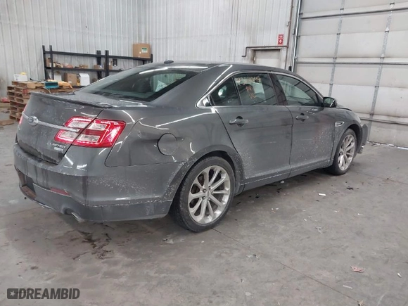 2015 Ford Taurus Limited with VIN 1FAHP2J8XFG192225, listed as a IAAI auction lot 41324244 with 100,395 mi miles. Bid and sale history available at carsss.com. Image 4.