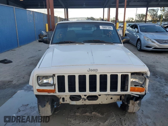 1999 Jeep Cherokee Sport with VIN 1J4FT68S6XL578679, listed as a Copart auction lot 76697394 with 196,110 mi miles and Salvage title. Bid and sale history available at DreamBid. Image 5.