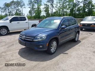 2012 Volkswagen Tiguan SEL with VIN WVGAV7AX7CW608637, listed as a IAAI auction lot 42173987 with 149,013 mi miles and . Bid and sale history available at DreamBid. Image 2.