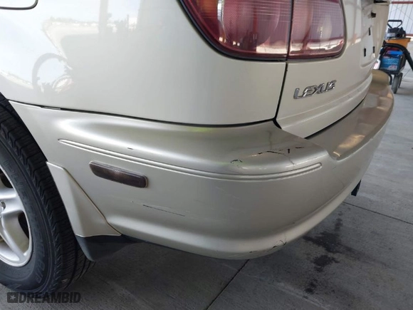 1999 Lexus RX 300 Luxury SUV with VIN JT6HF10UXX0020400, listed as a IAAI auction lot 41866556 with 237,899 mi miles. Bid and sale history available at carsss.com. Image 6.