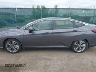2018 Honda Clarity Touring z VIN JHMZC5F3XJC001054, wystawiony jako IAAI lot #42292688 z przebiegiem 60 780 mil mil oraz . Historia ofert i sprzedaży dostępna na DreamBid. Obrazek 14.