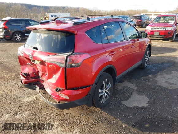 2016 Toyota RAV4 LE with VIN JTMBFREVXGJ100692, listed as a IAAI auction lot 41847333 with 130,822 mi miles. Bid and sale history available at carsss.com. Image 4.