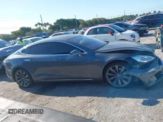 2014 Tesla Model S 60 with VIN 5YJSA1H1XEFP31911, listed as a IAAI auction lot 42029215 with Not Provided miles and . Bid and sale history available at DreamBid. Image 13.