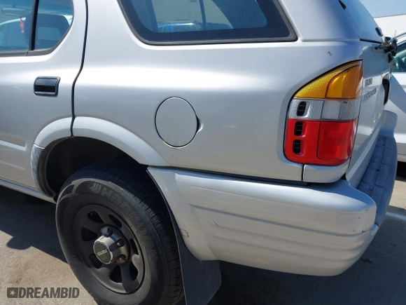 1998 Isuzu Rodeo S with VIN 4S2CM58WXW4325350, listed as a IAAI auction lot 42084411 with 292,784 mi miles. Bid and sale history available at carsss.com. Image 14.