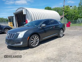 2013 Cadillac XTS Luxury z VIN 2G61R5S33D9101434, wystawiony jako IAAI lot #42290199 z przebiegiem 48 075 mil mil oraz . Historia ofert i sprzedaży dostępna na DreamBid. Obrazek 18.