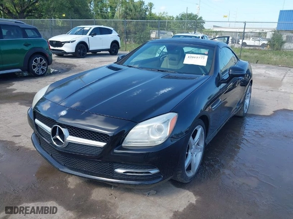 2013 Mercedes-Benz SLK-Class SLK 250 with VIN WDDPK4HA5DF059891, listed as a IAAI auction lot 42015777 with 79,255 mi miles. Bid and sale history available at carsss.com. Image 2.