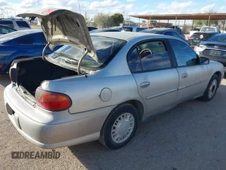 2004 Chevrolet Classic with VIN 1G1ND52F34M589464, listed as a IAAI auction lot 41566346 with 128,084 mi miles. Bid and sale history available at carsss.com. Image 4.
