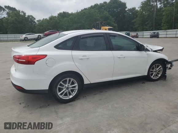 2015 Ford Focus SE with VIN 1FADP3F21FL246821, listed as a Copart auction lot 59732635 with 135,752 mi miles and Salvage title. Bid and sale history available at DreamBid. Image 3.