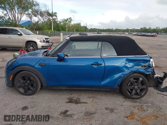 2022 MINI Convertible Cooper S z VIN WMW43DL06N3P19784, wystawiony jako IAAI lot #42635816 z przebiegiem 17 053 mil mil oraz . Historia ofert i sprzedaży dostępna na DreamBid. Obrazek 15.