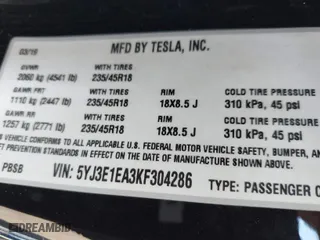2019 Tesla Model 3 Mid Range with VIN 5YJ3E1EA3KF304286, listed as a IAAI auction lot 42066908 with 164,667 mi miles. Bid and sale history available at carsss.com. Image 9.