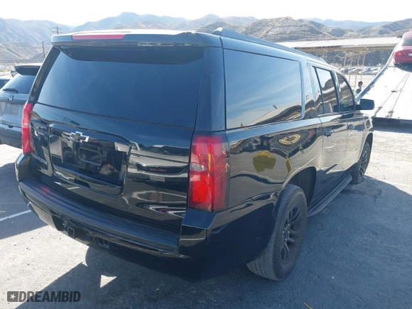 2015 Chevrolet Suburban LS with VIN 1GNSCHKC4FR247183, listed as a IAAI auction lot 41588924 with 283,741 mi miles. Bid and sale history available at carsss.com. Image 4.