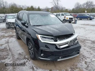 2021 Honda Pilot Touring 8-Passenger z VIN 5FNYF6H94MB091384, wystawiony jako IAAI lot #41567070 z przebiegiem 78 330 mil mil oraz . Historia ofert i sprzedaży dostępna na DreamBid. Obrazek 1.