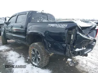 2017 Toyota Tacoma SR5 with VIN 5TFCZ5ANXHX061031, listed as a IAAI auction lot 41218297 with Not Provided miles and . Bid and sale history available at DreamBid. Image 3.