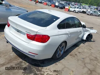2015 BMW 4 Series 428i with VIN WBA4A5C56FG052023, listed as a IAAI auction lot 40085862 with 90,796 mi miles and . Bid and sale history available at carsss.com. Image 4.