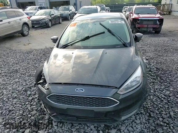 2016 Ford Focus SE z VIN 1FADP3F24GL313333, wystawiony jako Copart lot #60023715 z przebiegiem Nie podano mil oraz Szkoda całkowita • Salvage title. Historia ofert i sprzedaży dostępna na DreamBid. Obrazek 13.