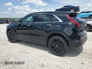 2023 Cadillac XT4 FWD Luxury с VIN 1GYAZAR47PF107473, выставлен на аукционе Copart как лот 59137665 с пробегом 9 198 миль миль и Списание • Salvage title. История ставок и продаж доступна на DreamBid. Изображение 2.