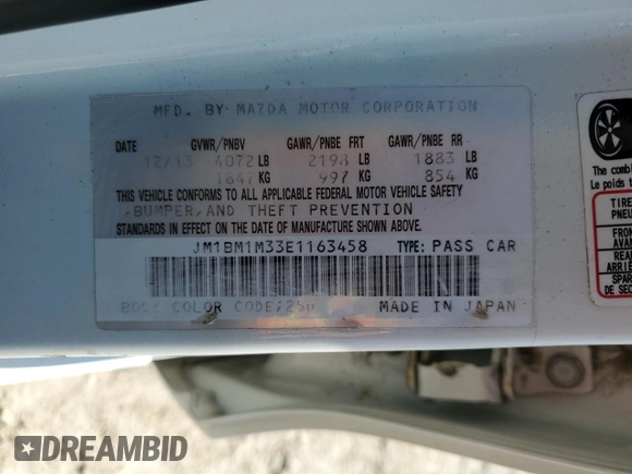 2014 Mazda 3 S Grand Touring z VIN JM1BM1M33E1163458, wystawiony jako Copart lot #52093725 z przebiegiem 141 757 mil mil oraz Szkoda całkowita • Salvage title. Historia ofert i sprzedaży dostępna na DreamBid. Obrazek 13.