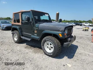 1997 Jeep Wrangler Sahara with VIN 1J4FY49S3VP519387, listed as a Copart auction lot 63822395 with 187,884 mi miles and Salvage title. Bid and sale history available at DreamBid. Image 4.