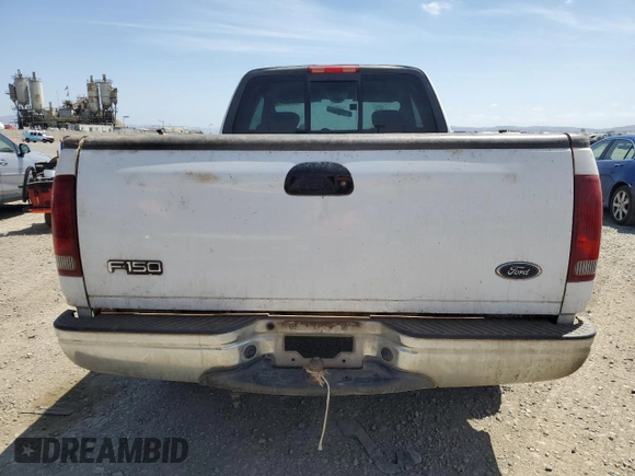 2003 Ford F-150 XL with VIN 2FTRX17213CA05950, listed as a Copart auction lot 54435115 with 310,503 mi miles and Salvage title. Bid and sale history available at DreamBid. Image 6.