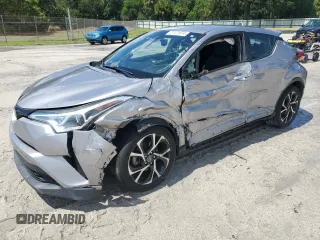 2018 Toyota C-HR XLE with VIN NMTKHMBX7JR021704, listed as a Copart auction lot 71171874 with 82,872 mi miles and Salvage Title. Bid and sale history available at DreamBid. Image 1.