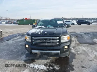 2015 GMC Canyon 4WD SLE z VIN 1GTG6BE31F1270675, wystawiony jako IAAI lot #41407183 z przebiegiem 143 117 mil mil oraz . Historia ofert i sprzedaży dostępna na DreamBid. Obrazek 12.