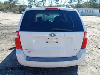 2009 Kia Sedona LX with VIN KNDMB233096312990, listed as a IAAI auction lot 41261428 with 254,323 mi miles. Bid and sale history available at carsss.com. Image 16.