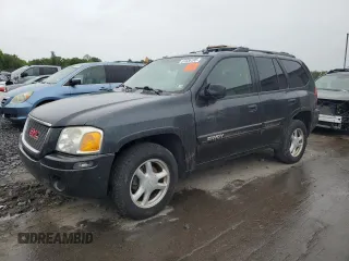 2005 GMC Envoy SLT z VIN 1GKDT13S452324077, wystawiony jako Copart lot #57836195 z przebiegiem 299 146 mil mil oraz Czysty tytuł • Clean title. Historia ofert i sprzedaży dostępna na DreamBid. Obrazek 1.