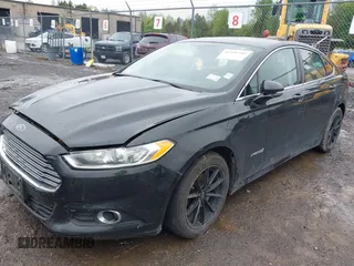 2014 Ford Fusion SE Hybrid with VIN 3FA6P0LU9ER310990, listed as a IAAI auction lot 42336303 with 197,588 mi miles and . Bid and sale history available at DreamBid. Image 2.