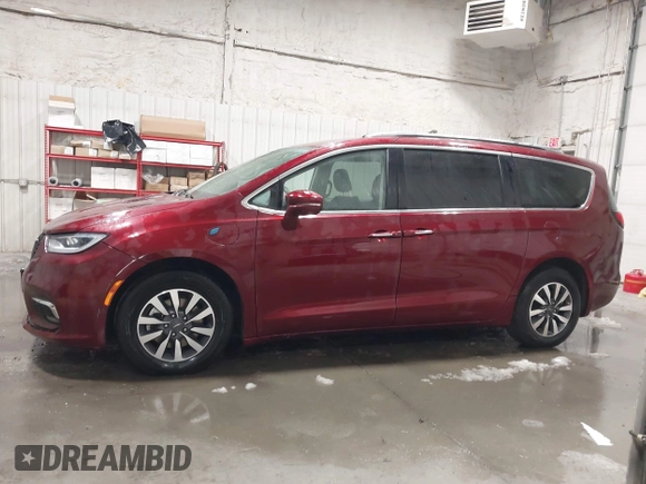 2021 Chrysler Pacifica Hybrid Touring L with VIN 2C4RC1L71MR581260, listed as a IAAI auction lot 42014401 with 68,719 mi miles and . Bid and sale history available at DreamBid. Image 14.