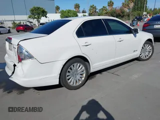 2012 Ford Fusion Hybrid z VIN 3FADP0L3XCR276182, wystawiony jako IAAI lot #42260450 z przebiegiem 133 567 mil mil oraz . Historia ofert i sprzedaży dostępna na DreamBid. Obrazek 4.