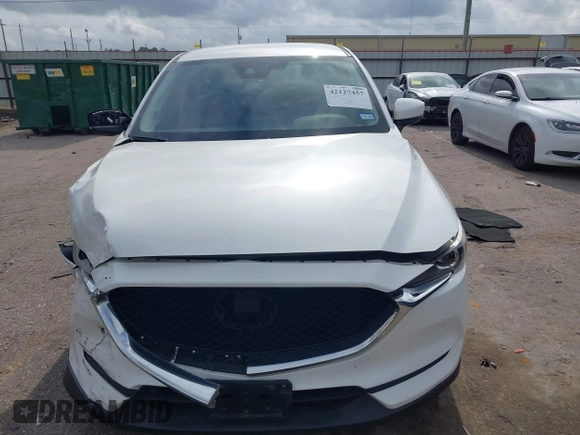 2020 Mazda CX-5 Touring z VIN JM3KFBCM2L0786784, wystawiony jako IAAI lot #42127457 z przebiegiem 62 665 mil mil oraz . Historia ofert i sprzedaży dostępna na DreamBid. Obrazek 12.