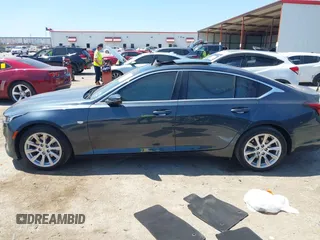 2021 Cadillac CT5 Luxury z VIN 1G6DW5RKXM0144424, wystawiony jako IAAI lot #41985803 z przebiegiem 65 555 mil mil oraz . Historia ofert i sprzedaży dostępna na DreamBid. Obrazek 14.