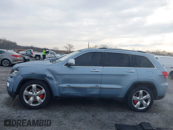 2013 Jeep Grand Cherokee Overland with VIN 1C4RJFCT2DC572978, listed as a IAAI auction lot 41468915 with 223,528 mi miles. Bid and sale history available at carsss.com. Image 14.