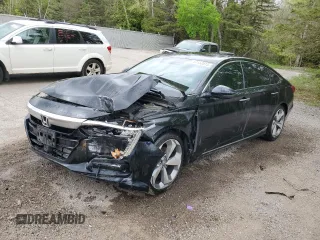 2019 Honda Accord Touring z VIN 1HGCV1F93KA804401, wystawiony jako Copart lot #57152815 z przebiegiem 140 331 mil mil oraz Szkoda całkowita • Salvage title. Historia ofert i sprzedaży dostępna na DreamBid. Obrazek 1.