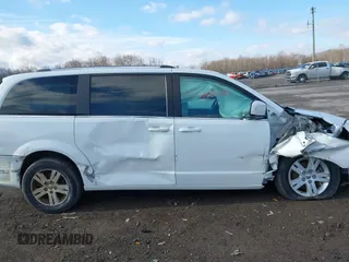 2019 Dodge Grand Caravan SXT with VIN 2C4RDGCG4KR771745, listed as a IAAI auction lot 41859267 with 97,436 mi miles and . Bid and sale history available at DreamBid. Image 6.