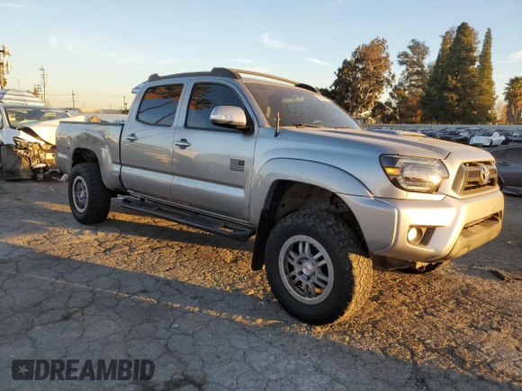 2014 Toyota Tacoma PreRunner with VIN 3TMKU4HNXEM041311, listed as a Copart auction lot 84065684 with 212,473 mi miles and Salvage title. Bid and sale history available at DreamBid. Image 4.