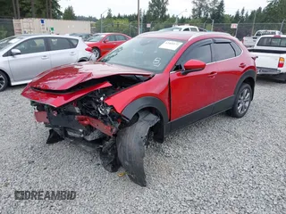 2023 Mazda CX-30 S Premium with VIN 3MVDMBDM1PM520048, listed as a IAAI auction lot 42468172 with 7,277 mi miles and . Bid and sale history available at DreamBid. Image 2.