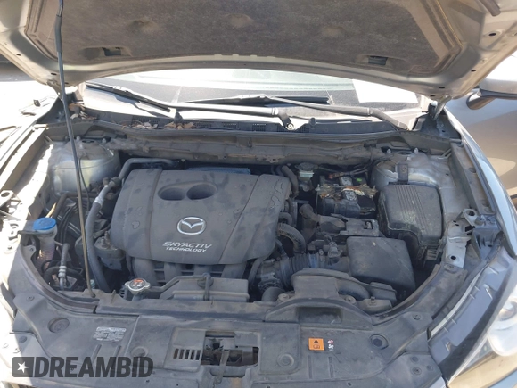 2014 Mazda CX-5 Sport with VIN JM3KE2BE7E0371203, listed as a IAAI auction lot 42243756 with 121,534 mi miles and . Bid and sale history available at DreamBid. Image 10.