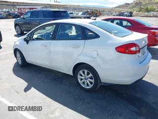 2012 Ford Fiesta SE with VIN 3FADP4BJ7CM102932, listed as a IAAI auction lot 41760394 with 70,394 mi miles and . Bid and sale history available at carsss.com. Image 3.