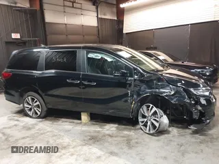 2021 Honda Odyssey Touring with VIN 5FNRL6H83MB040138, listed as a IAAI auction lot 39150096 with 61,322 mi miles and . Bid and sale history available at DreamBid. Image 13.