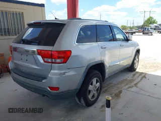 2011 Jeep Grand Cherokee Laredo with VIN 1J4RR4GG3BC540655, listed as a IAAI auction lot 42158522 with 214,341 mi miles and . Bid and sale history available at DreamBid. Image 4.