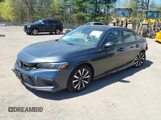 2023 Honda Civic Sedan EX with VIN 2HGFE1F71PH324023, listed as a IAAI auction lot 39256308 with 6,451 mi miles. Bid and sale history available at carsss.com. Image 2.