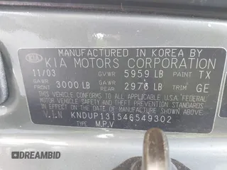 2004 Kia Sedona LX with VIN KNDUP131546549302, listed as a IAAI auction lot 41819215 with 125,881 mi miles. Bid and sale history available at carsss.com. Image 9.
