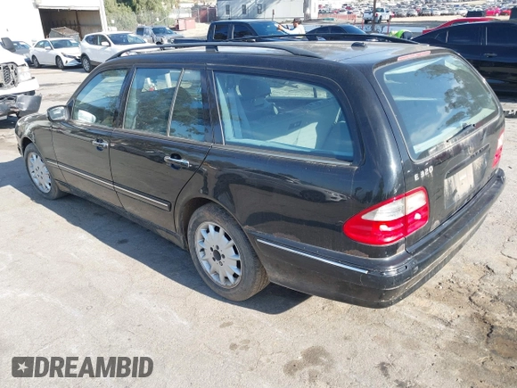 2001 Mercedes-Benz E-Class with VIN WDBJH65J31B381879, listed as a IAAI auction lot 41855504 with 153,667 mi miles. Bid and sale history available at carsss.com. Image 3.