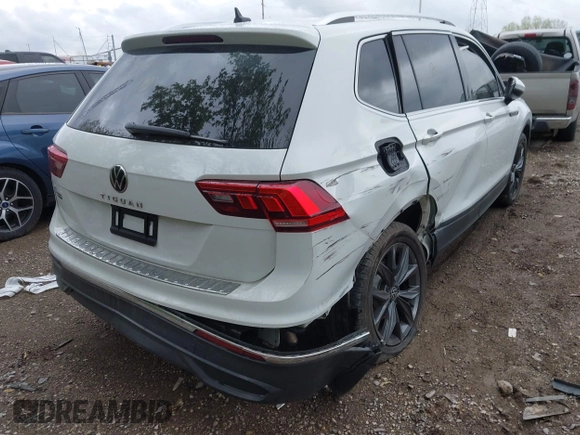 2022 Volkswagen Tiguan SE z VIN 3VV3B7AX4NM125651, wystawiony jako IAAI lot #42114490 z przebiegiem 67 628 mil mil oraz . Historia ofert i sprzedaży dostępna na DreamBid. Obrazek 4.